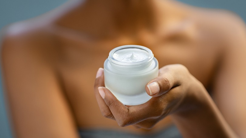 Woman Holding Moisturiser
